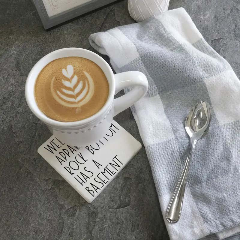 Rock bottom has a basement. Square Limestone Coaster by Tipsy