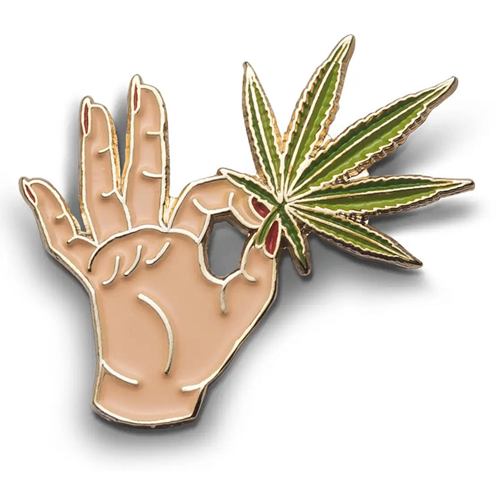Hand holding a cannabis leaf Enamel Pin - CC
