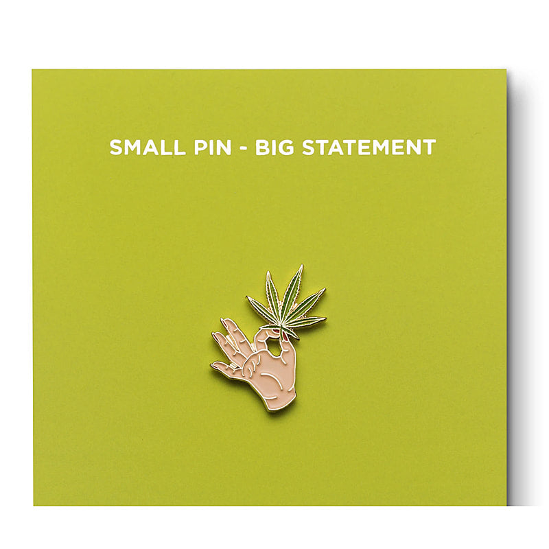 Hand holding a cannabis leaf Enamel Pin - CC